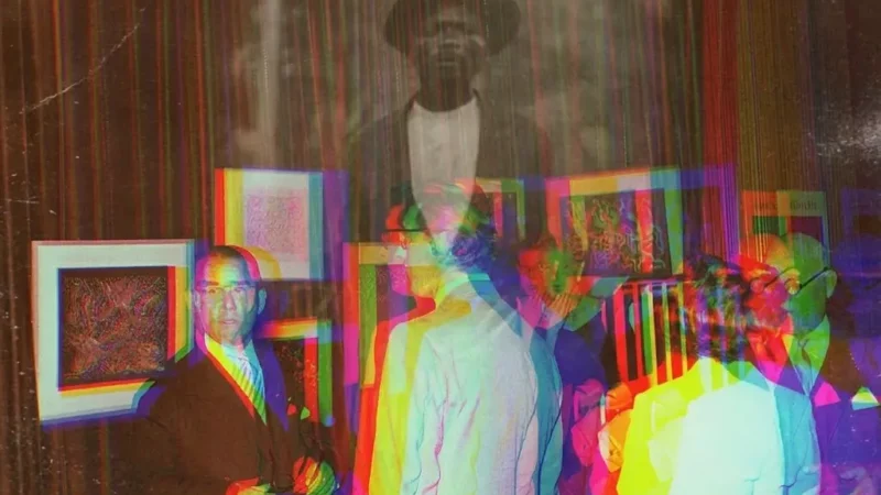 Guests at a 1950s exhibition opening, overlaid with the ghostly portrait of Djilatendo in a hat.
